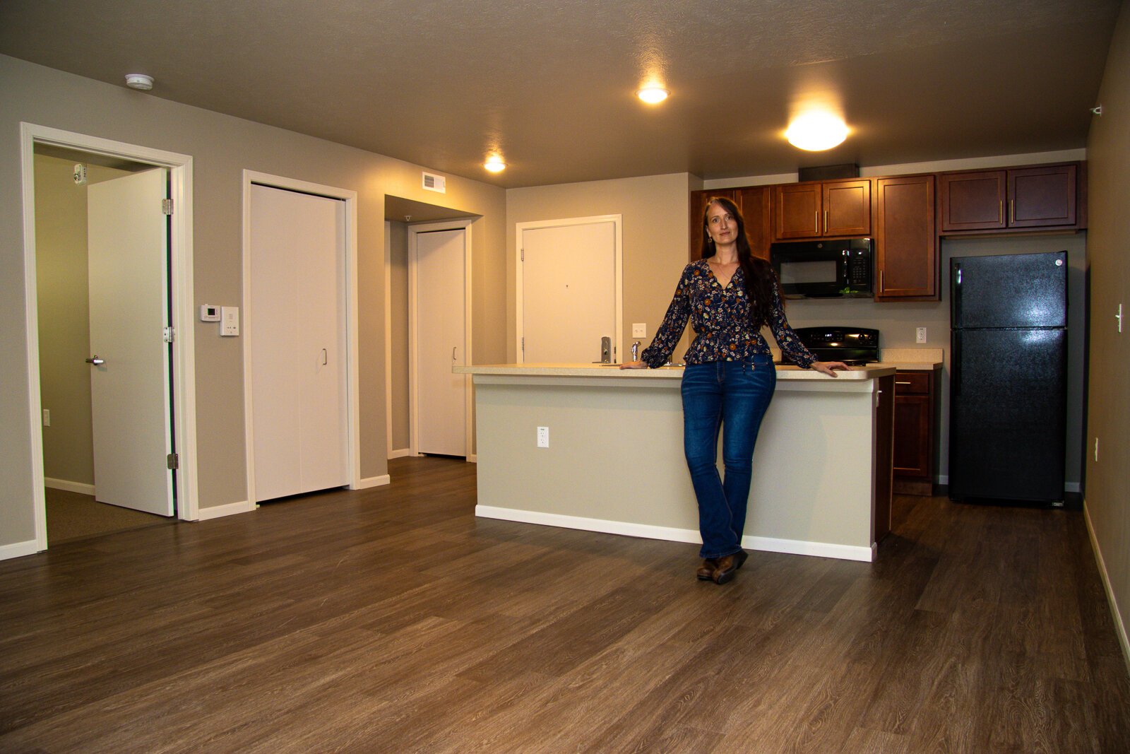 Kittie Tuinstra shows off an apartment interior.