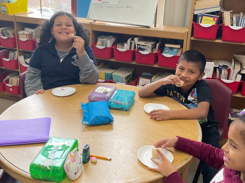 Third-grade students at Neinas Dual Language Learning Academy in Detroit trying a yummy fruity roll-up tasting.