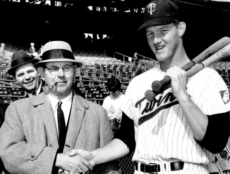 Jim Kaat (right) standing on the playing field at Metropolitan Stadium in Bloomington, Minnesota, with his father, John Kaat, of Zeeland, prior to Game 7 of the 1965 World Series.