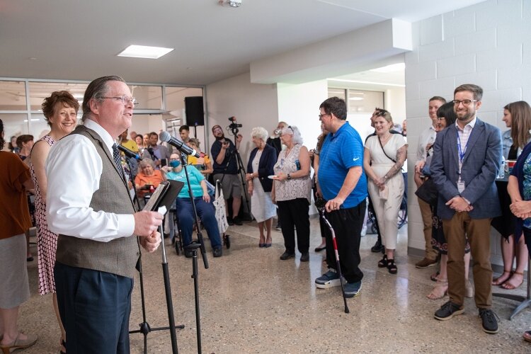 David Bulkowski, executive director of Disability Advocates of Kent County, thanks community members for attending the ribbon-cutting for the new home for Special Olympics Michigan (SOMI).