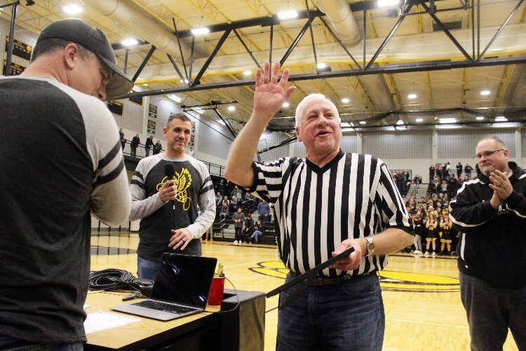 Loren Joostberns received a standing ovation as he learned a basketball court would be named in his honor. 