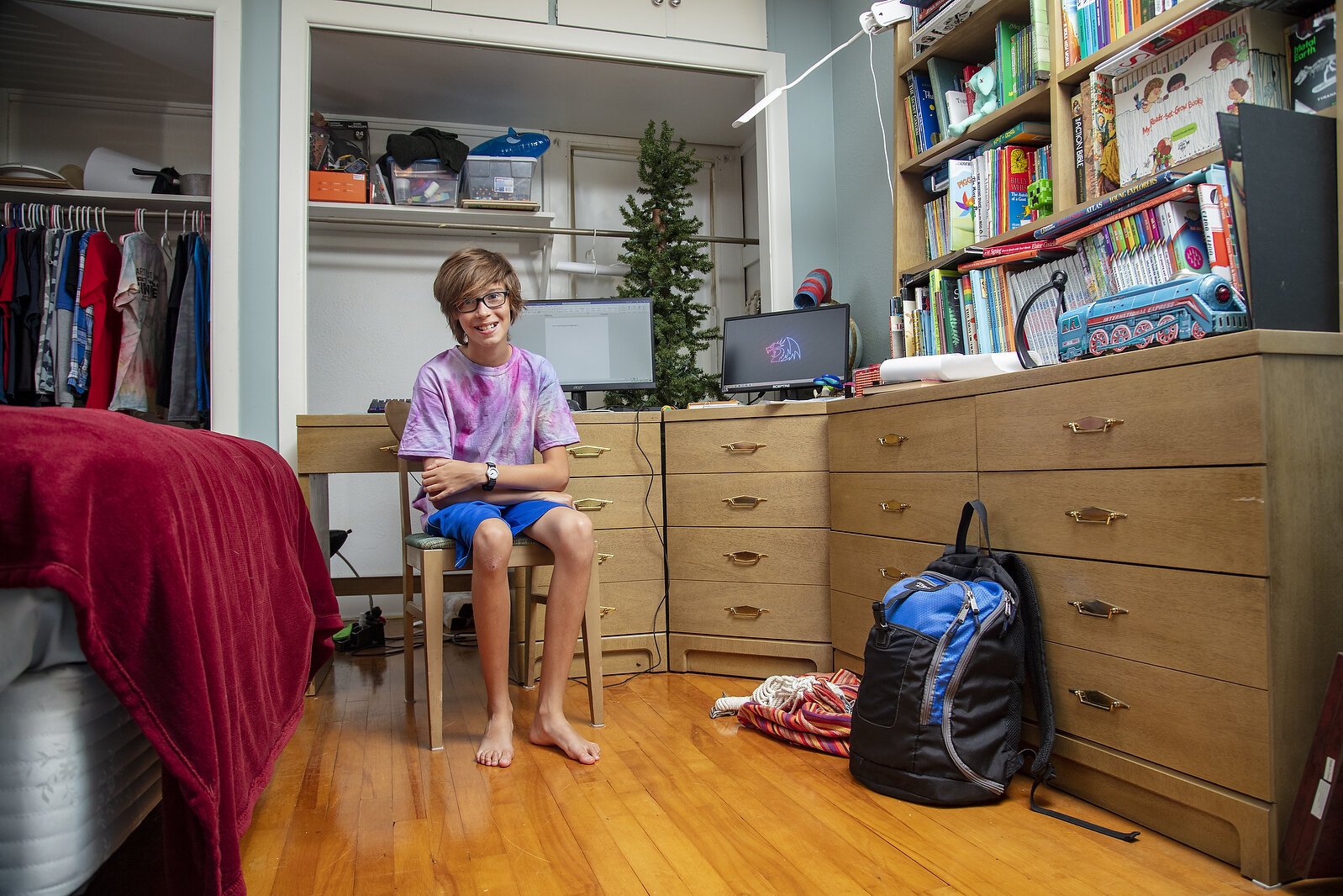 John Lehnert shows his at-home desk where he will be doing his school work.