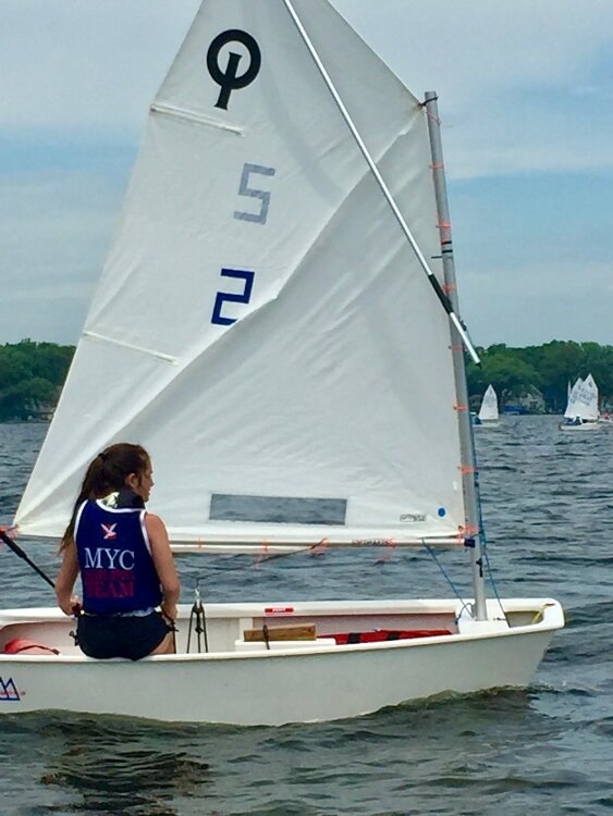 Emily Nguyen, sils an Optomist sail boat with the Muskegon Junior Sailing Program.