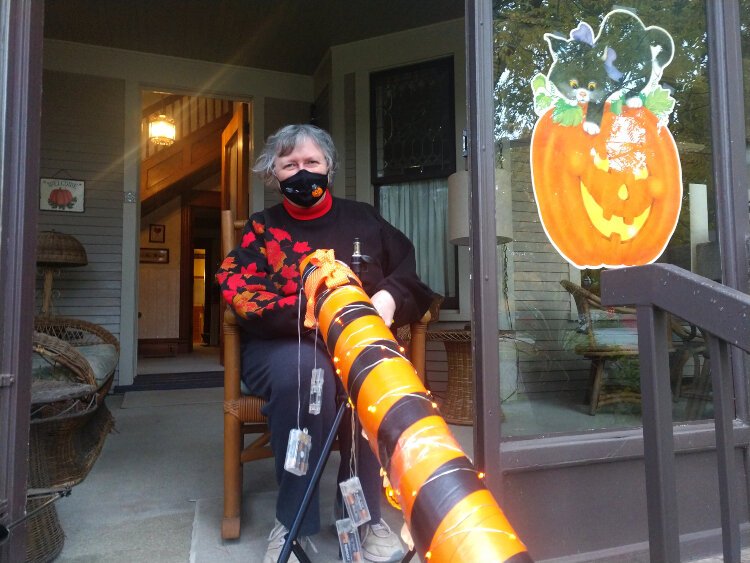 Carol Myers shows off the socially distanced, but festive Halloween tube at her 12th Street Holland home.