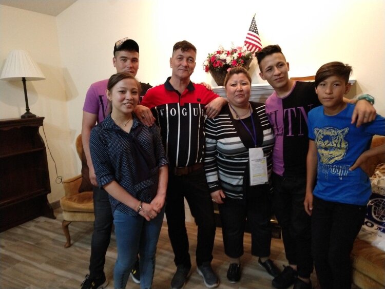 Ebrahim Mohammad Eshaq with his wife, Farzana Saadat, and their four teenage children.