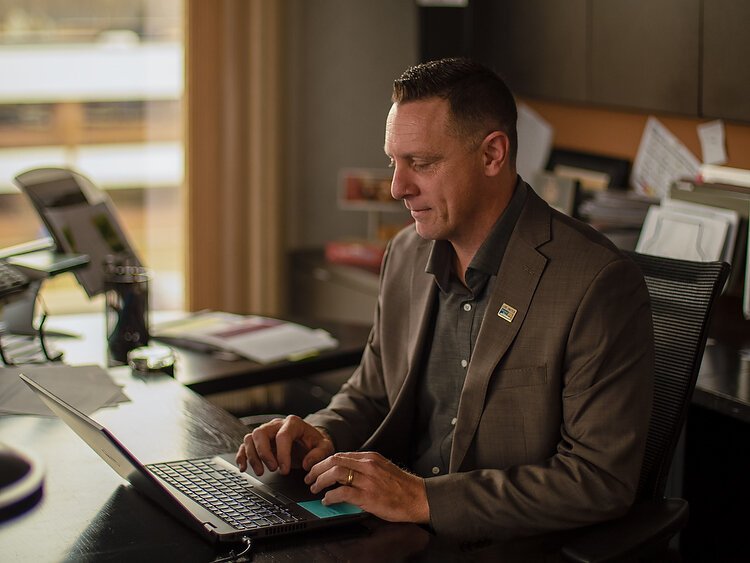 Patrick Moran in his office in Holland.  Photo by Matthew J. Huizenga
