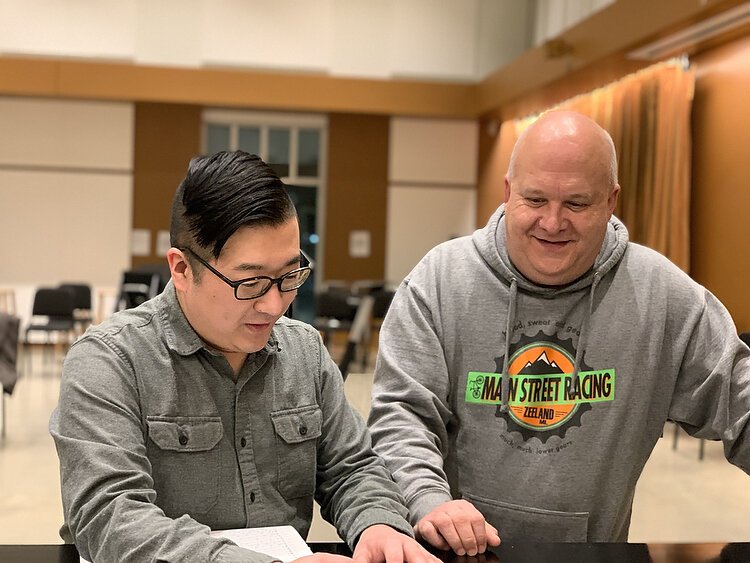 Jordan VanHemert and Keith Walker review music. Photo by Shandra Martinez