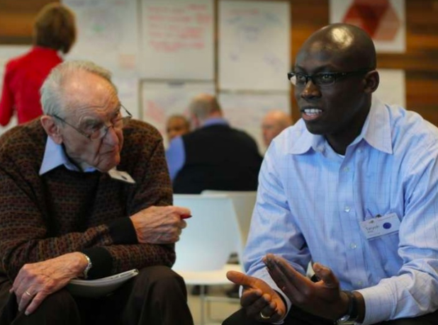 Gordon Van Wylen (left) and Taiyon Afrik talk during the 2011 Future Search Initiative. Photo courtesy Boileau Communications