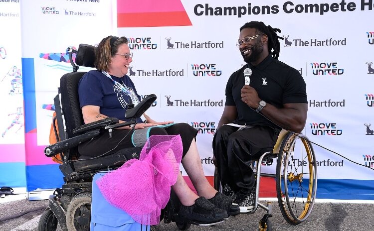Gold medalist Matt Scott gifted four athletes custom adaptive gear, including a boccia set for Heather Champlin, 48, of Cedar Springs.