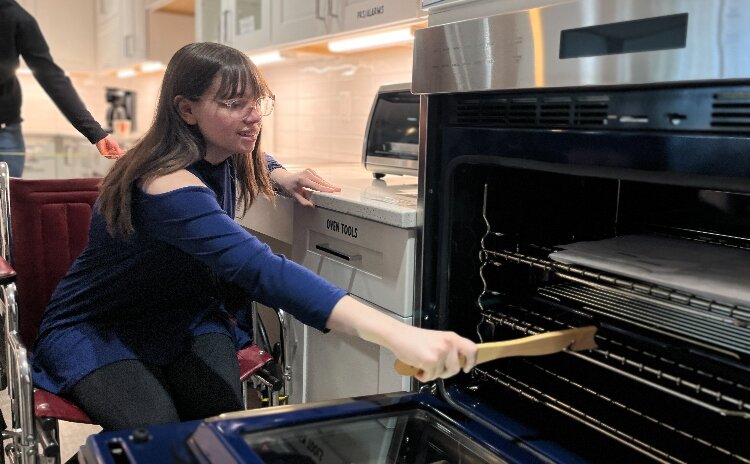 KCAD design students explore inclusive design by navigating kitchen activities from a wheelchair user's perspective.