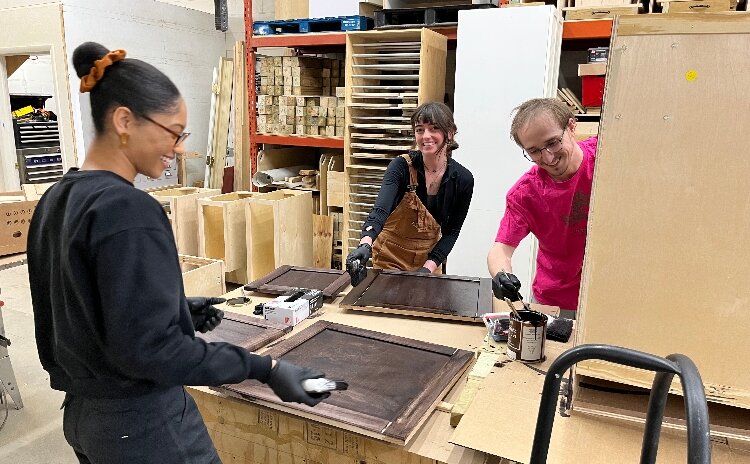 James Fischer and fellow KCAD students collaborating on the kitchen display at DAKC.