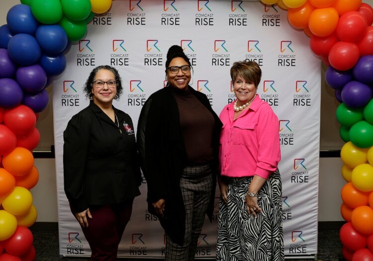 (From left) Former Comcast RISE recipients, Angelita Valdez, of Servicios de Esperanza; Reynelda Jones, of A Solution B, and Jessica Crosby, of Delight in Designs, pose for a photo during the Comcast RISE kickoff event at the Grand Rapids Chamber.