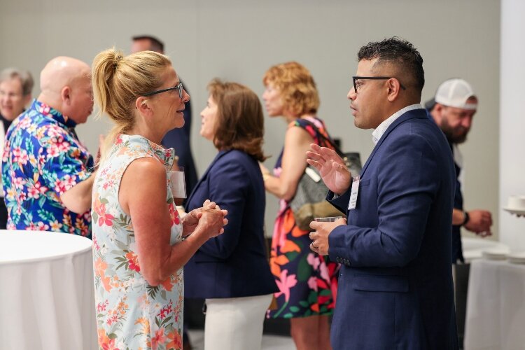 People chat during a recent gathering for the DeVos Institute of Arts Management.
