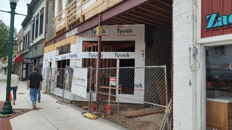 Nextdoor to the newly reopened Public has been replaced with framing for a three-story mixed-use development and pedestrian passageway. 