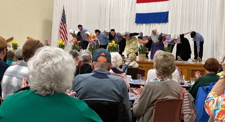 Tulip Time visitors applaud Dutch Dancing performance at Evergreen Commons.
