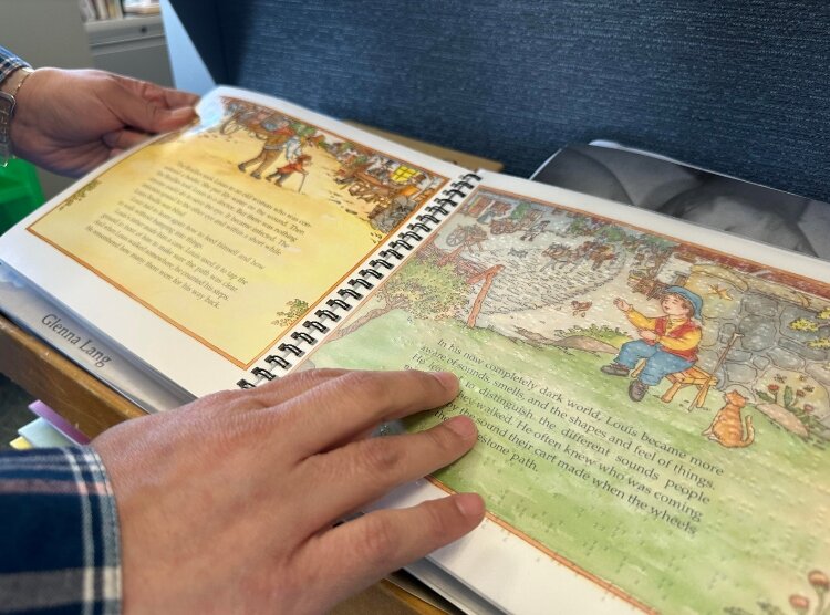 The library carries a large collection of braille books.