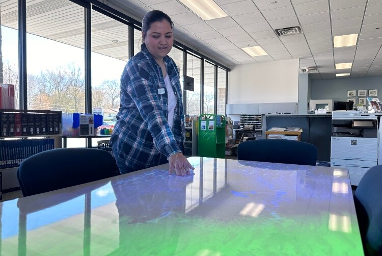 Library Assistant Syarifah Alhasni demonstrates Tovertafel (Dutch for Magic Table), an accessible library feature.