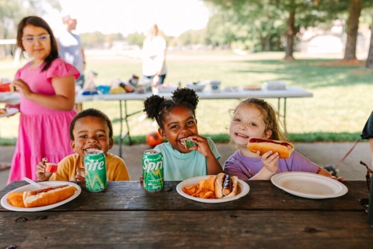 Children of the first-time homeowners in Park Vista Place celebrate their new neighborhood. (Lakeshore Habitat)