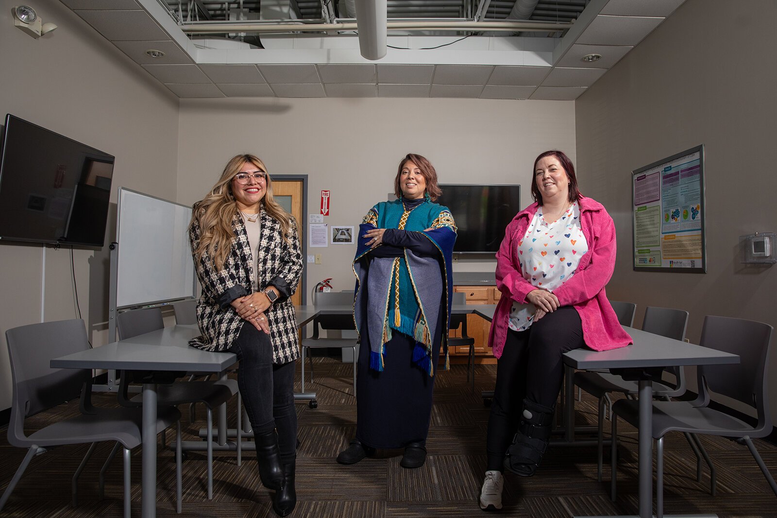 Care Model Training recipients Dinora Quintanilla (far left) and Kim Poplaski (far right) with Care Model Training facilitator Vanessa Jimenez (center).