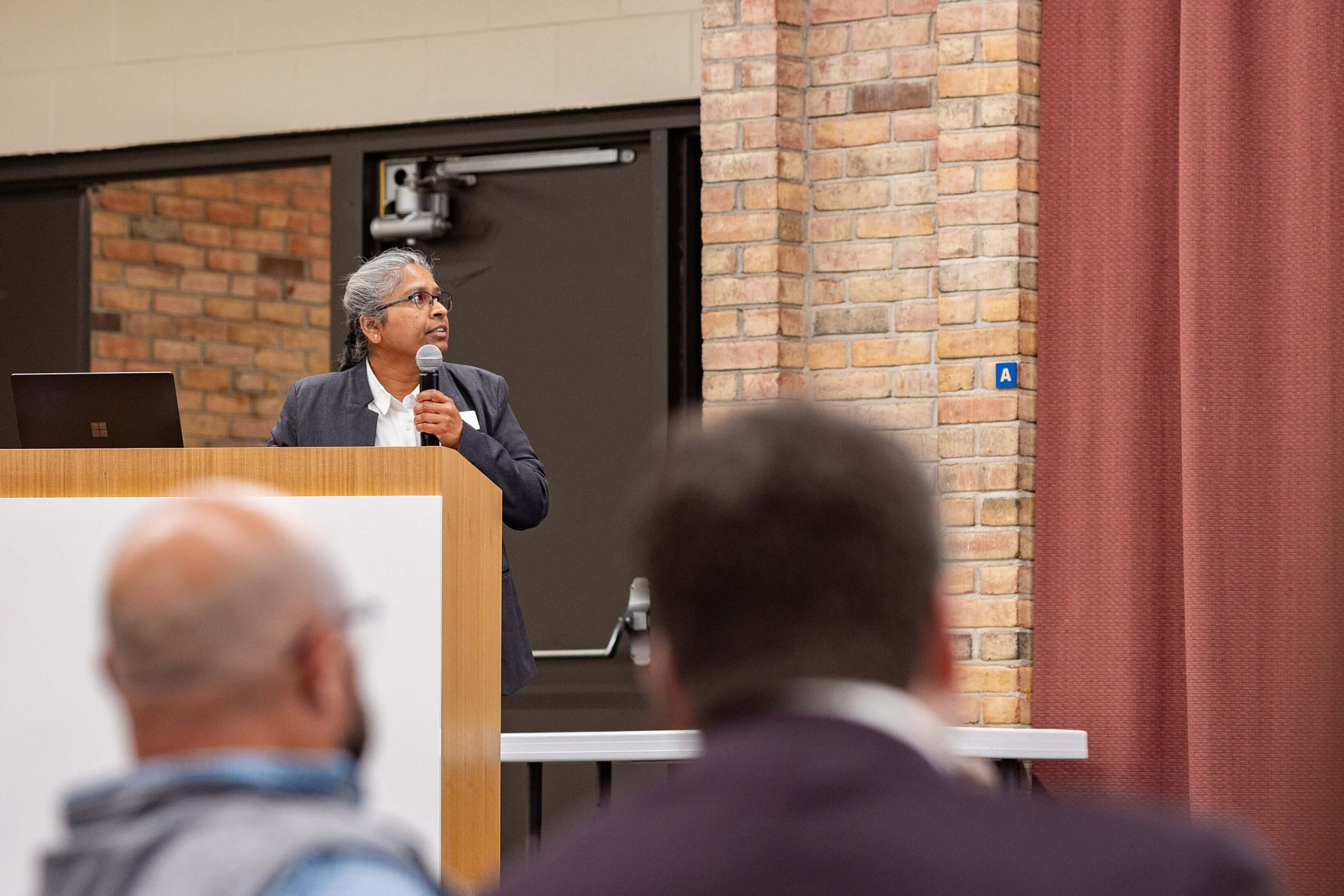 Dr. Preeti Rao, senior community data analyst for IFF, presents at the event.