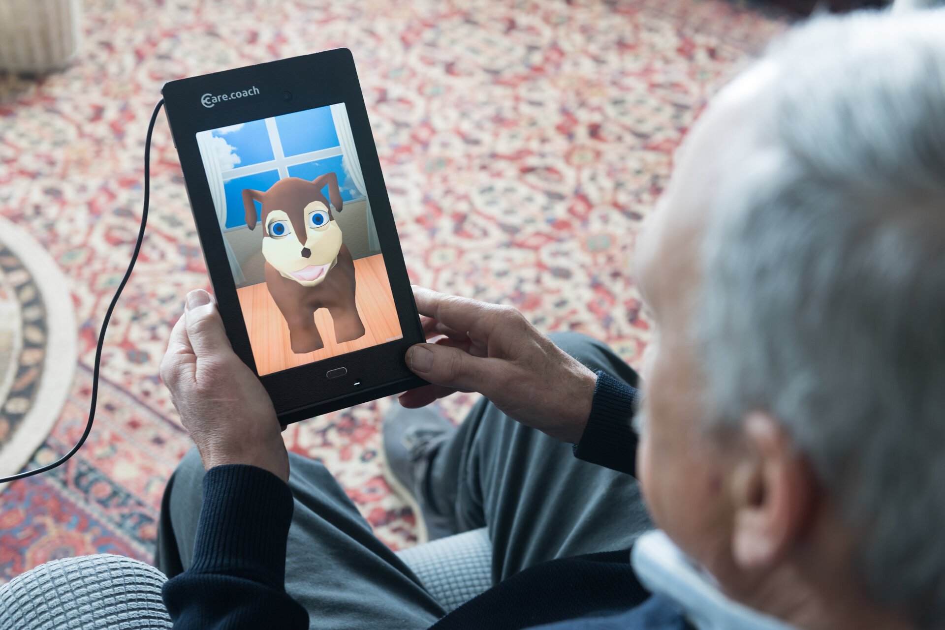 A man uses the care.coach tool, currently being deployed by Grand Rapids-based Care Resources PACE.