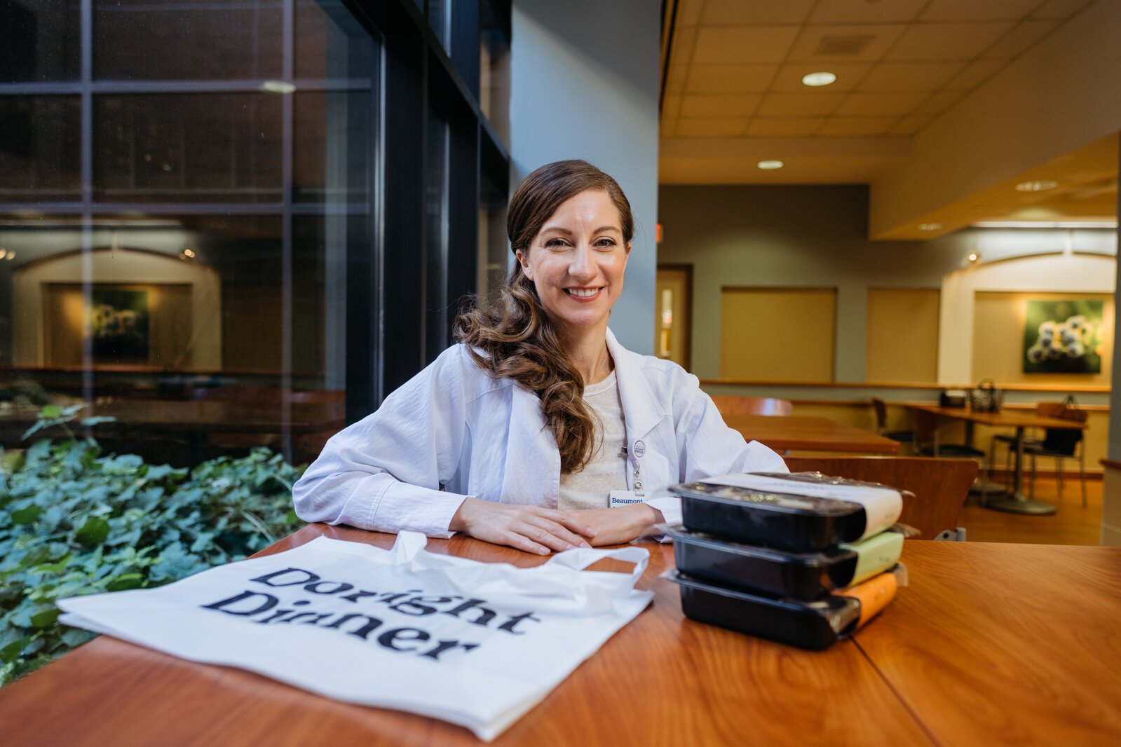 Sarah Berry with a stack of medically tailored meals.