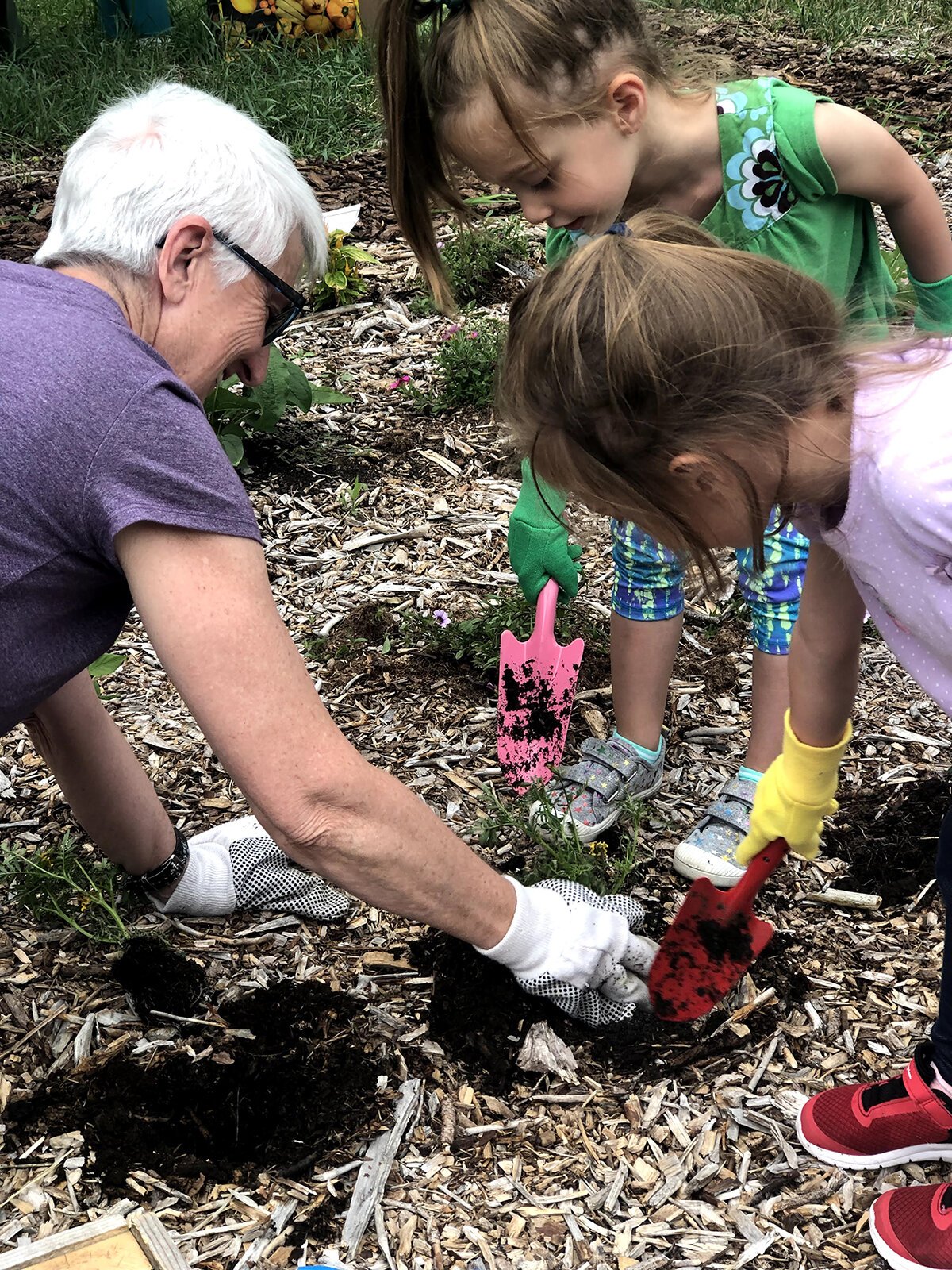 Children in the Child and Family Charities Family Growth Center's community garden.