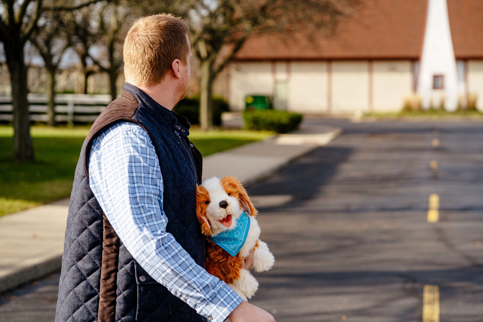 Andrew Dabrowski, community care program manager for The Senior Alliance, holds a Joy for All robotic dog.