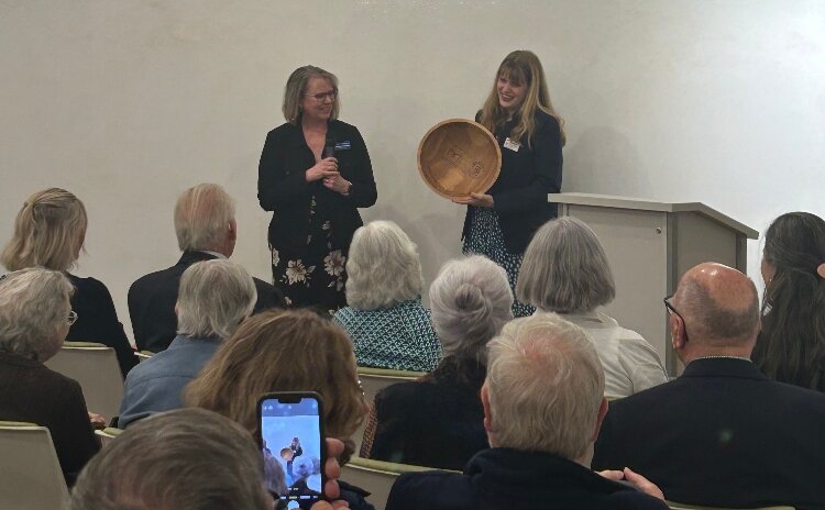 In June 2025, Katelyn VerMerris and Michelle Stempien presented Dr. Bob Swierenga with a custom wooden bowl honoring his contributions to local history, at a joint event by the Holland Museum and Zeeland Historical Society.