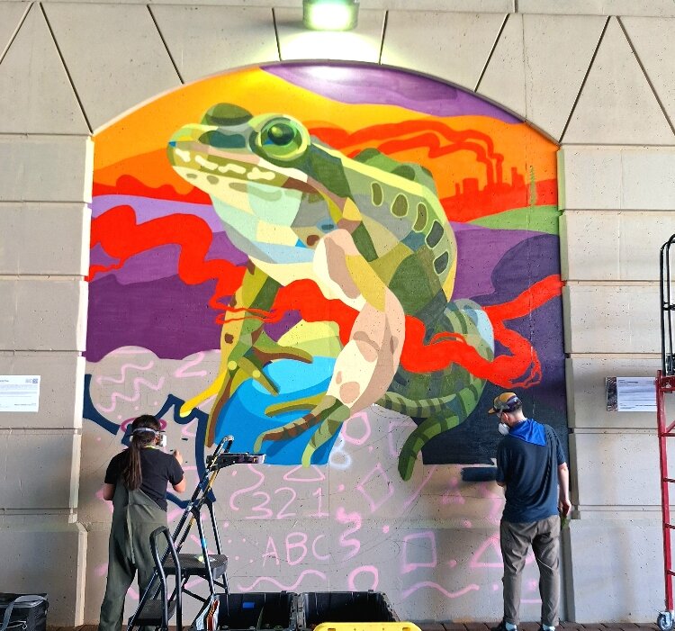 Mikaila Doede was one of eight student apprentices chosen to support the professional muralists while developing their own work.